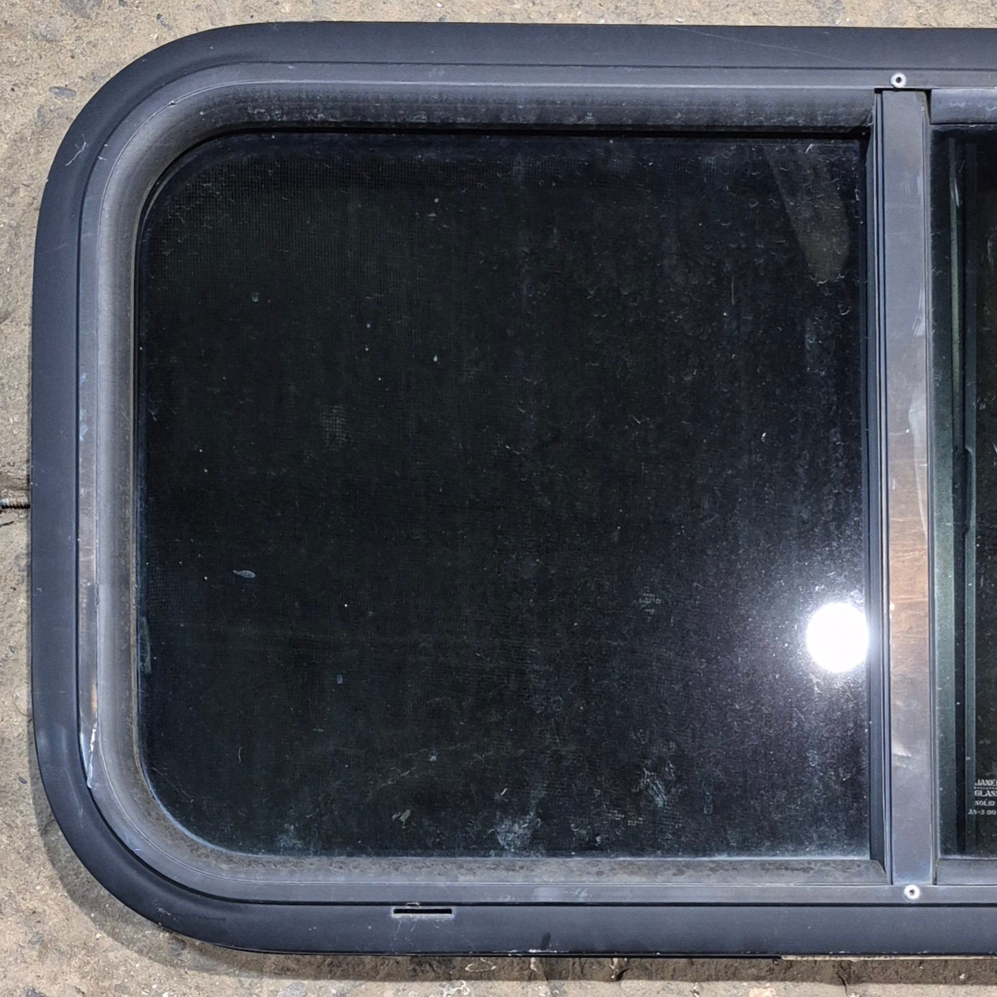 Used Black Radius Opening Window : 29 1/2" W x 14 1/4" H x 1 1/4" - Young Farts RV Parts