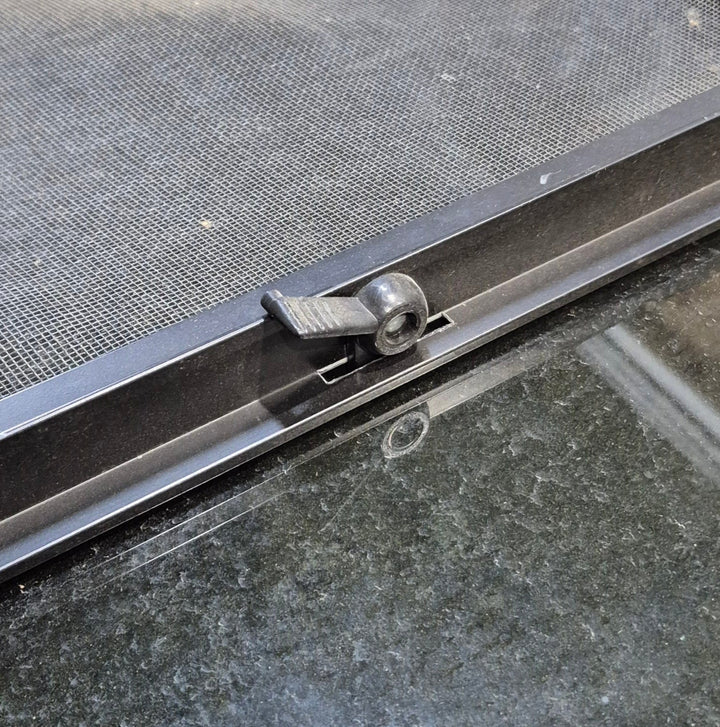 Used Black Radius Opening Window : 29 1/2" W x 14 1/4" H x 1 1/4" - Young Farts RV Parts