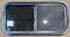 Used Black Radius Opening Window : 29 1/2" W x 14 1/4" H x 1 1/4" - Young Farts RV Parts