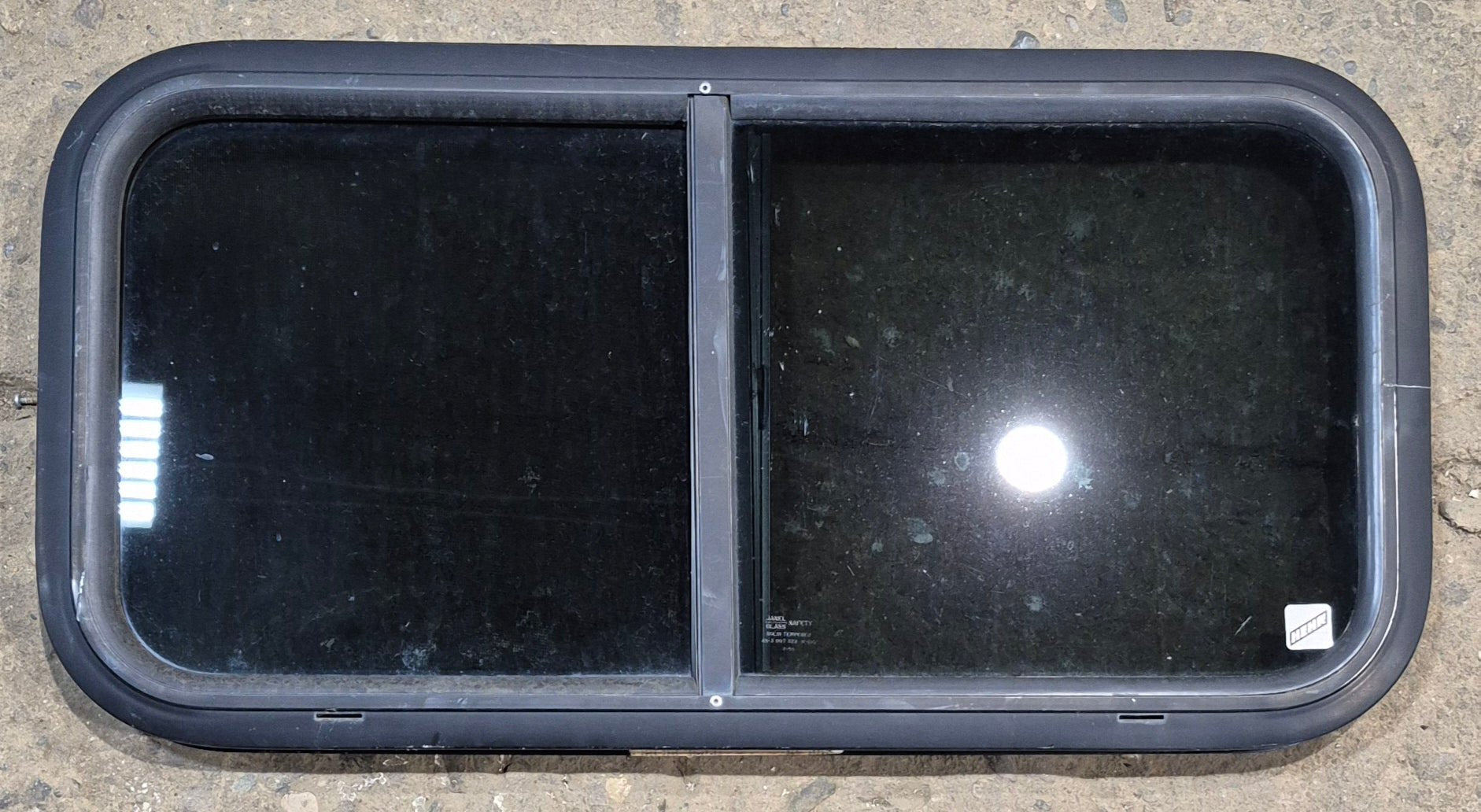 Used Black Radius Opening Window : 29 1/2" W x 14 1/4" H x 1 1/4" - Young Farts RV Parts