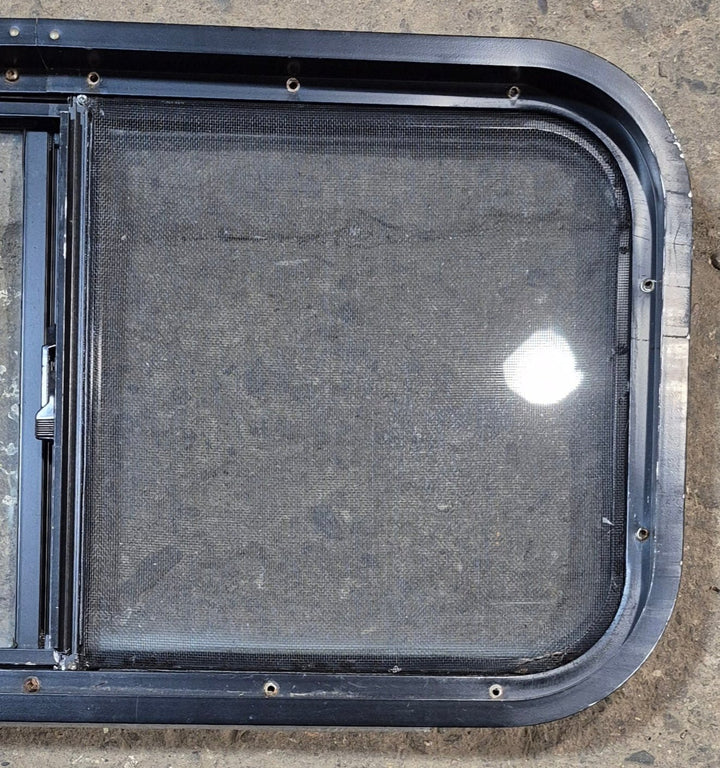Used Black Radius Opening Window : 29 1/2" W x 14 3/4" H x 1 7/8" - Young Farts RV Parts