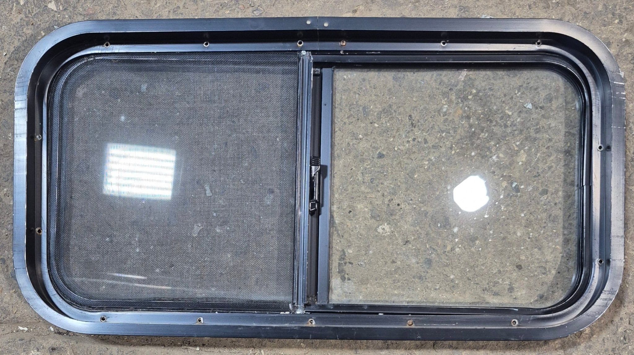 Used Black Radius Opening Window : 29 1/2" W x 14 3/4" H x 1 7/8" - Young Farts RV Parts