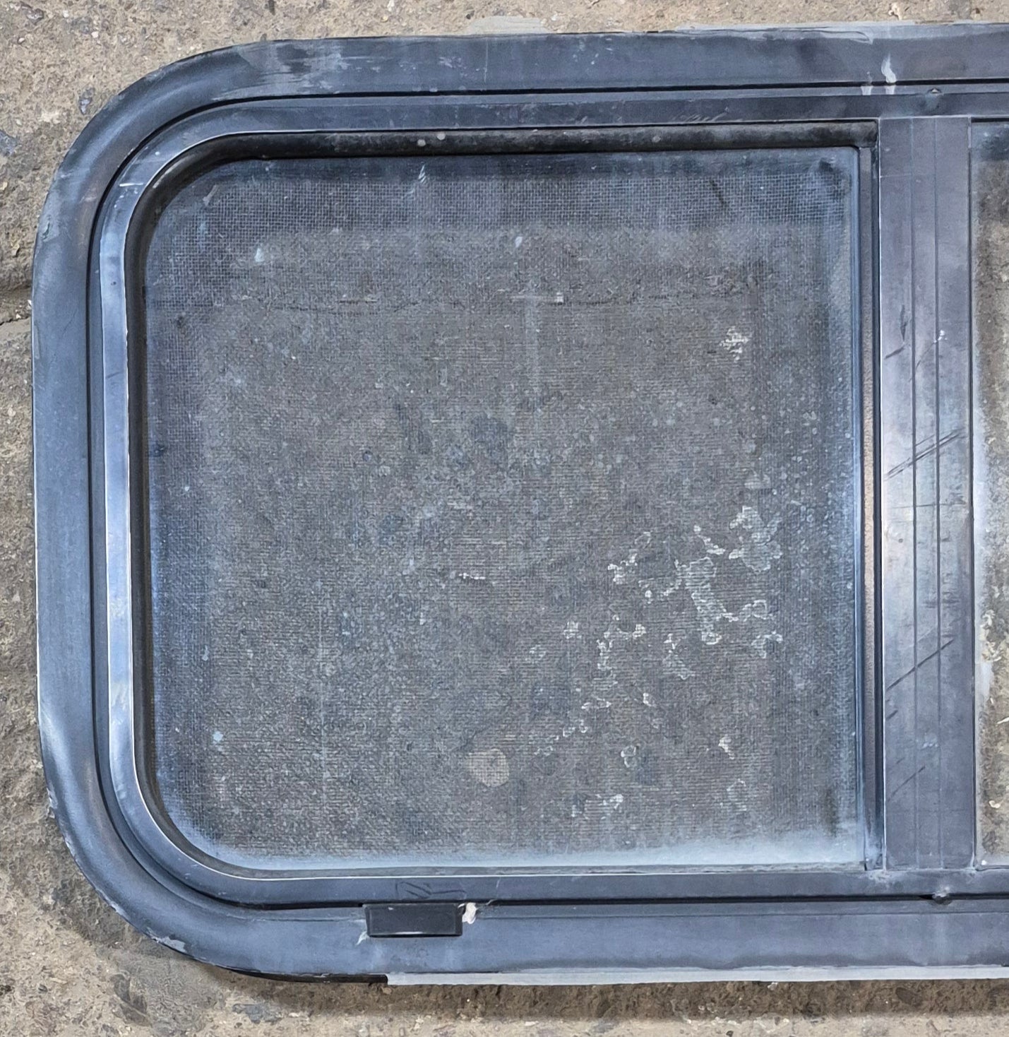 Used Black Radius Opening Window : 29 1/2" W x 14 3/4" H x 1 7/8" - Young Farts RV Parts