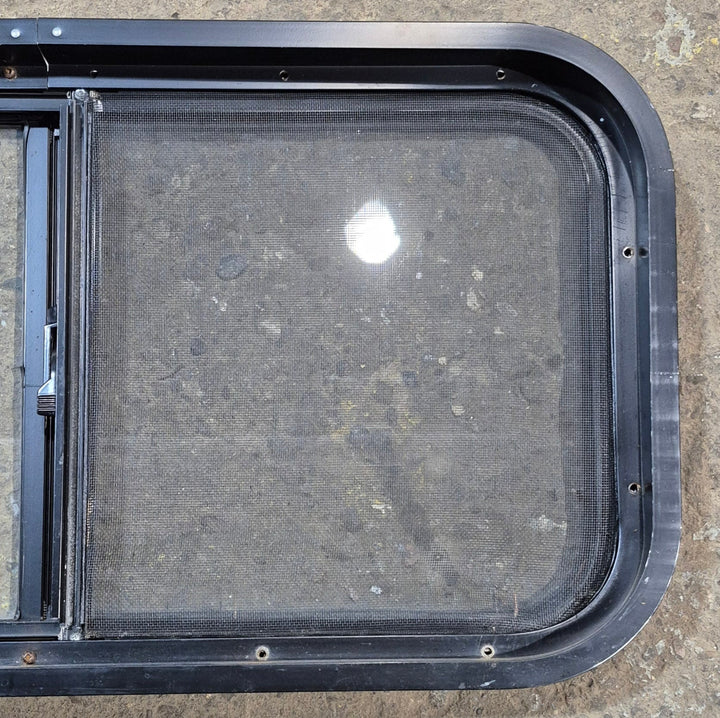 Used Black Radius Opening Window : 29 1/2" W x 14 3/4" H x 1 7/8" - Young Farts RV Parts