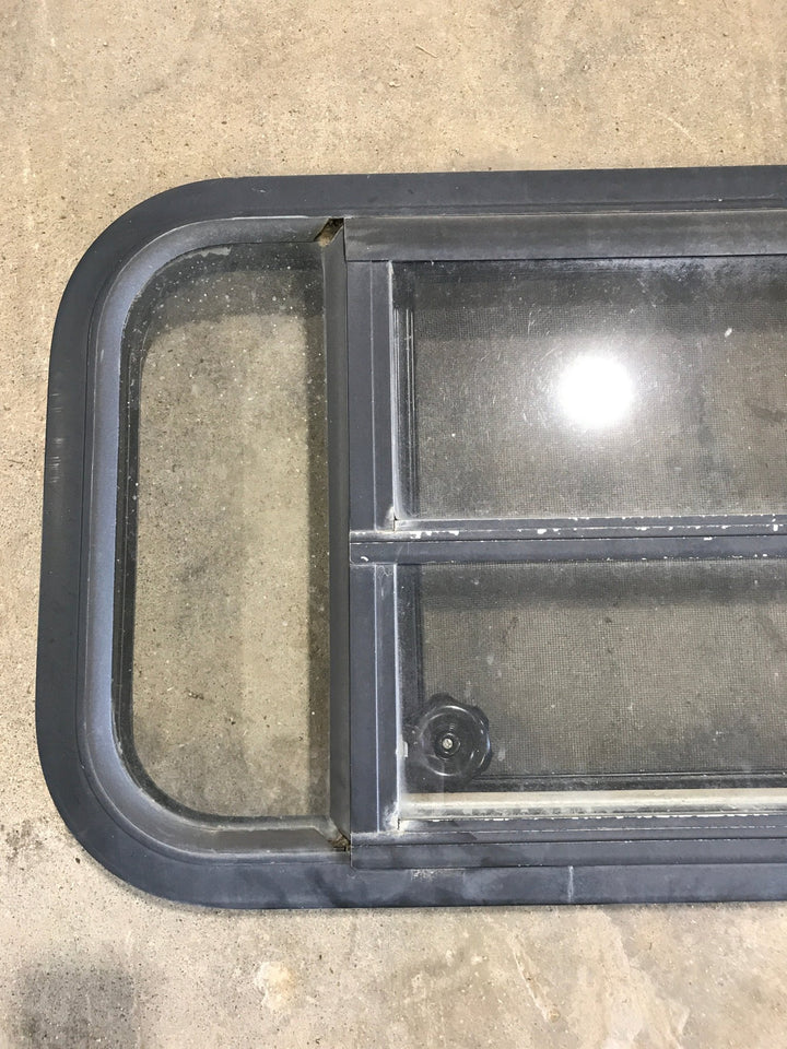Used Black Radius Opening Window : 29 1/2" W x 14 3/4" H x 2" - Young Farts RV Parts