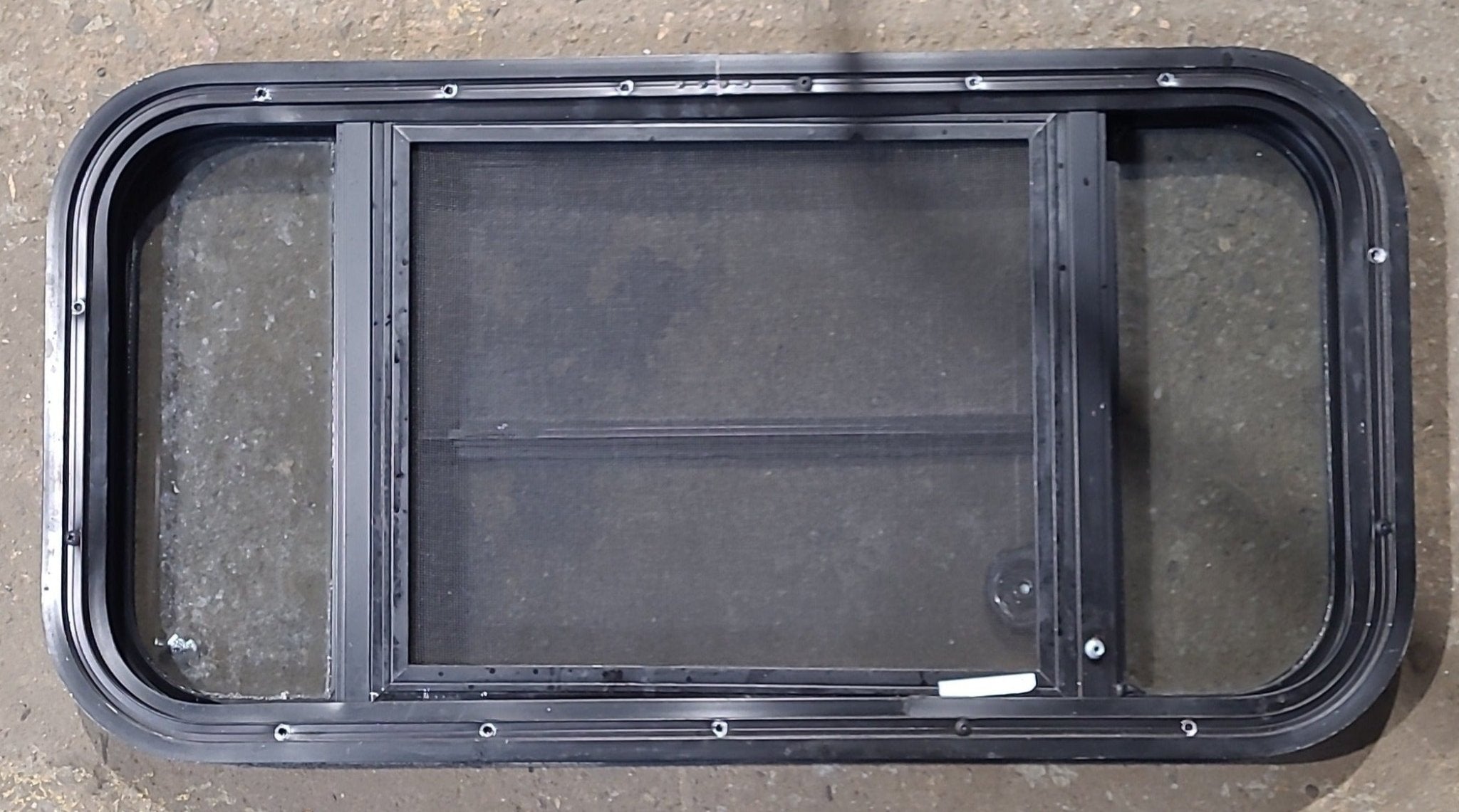 Used Black Radius Opening Window : 29 1/2" W x 14 5/8" H x 2" D - Young Farts RV Parts