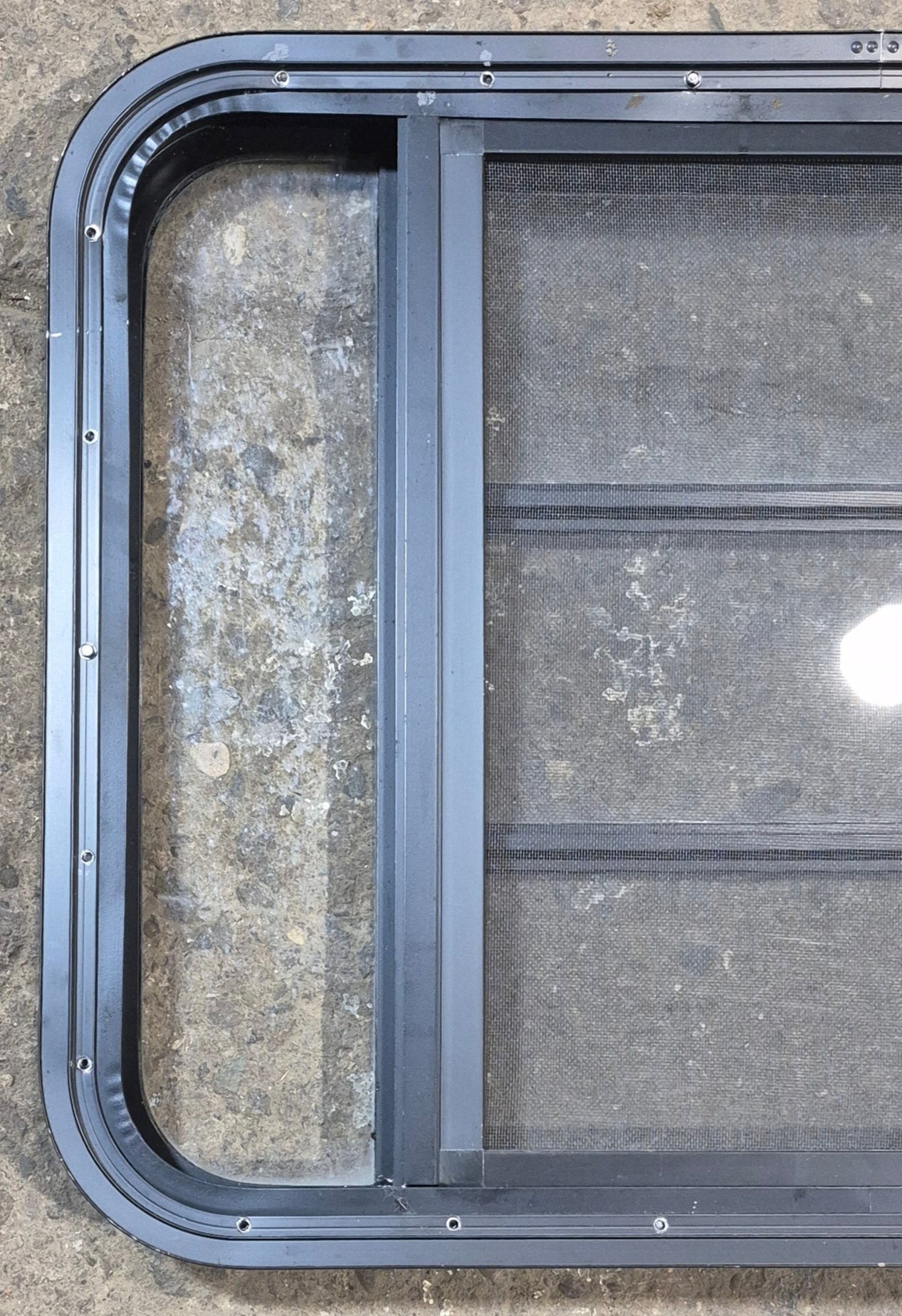 Used Black Radius Opening Window : 29 1/2" W x 22 1/2" H x 1 3/4" - Young Farts RV Parts