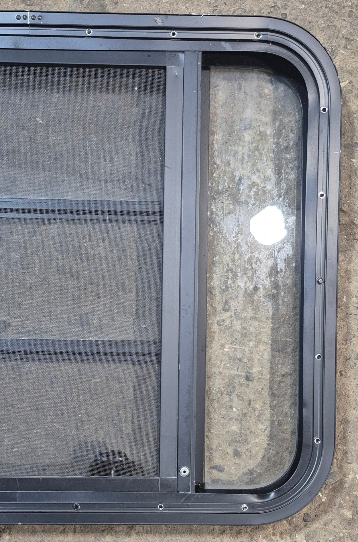 Used Black Radius Opening Window : 29 1/2" W x 22 1/2" H x 1 3/4" - Young Farts RV Parts