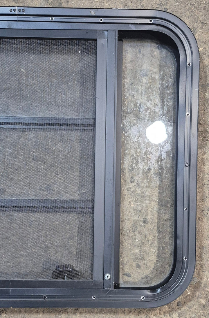 Used Black Radius Opening Window : 29 1/2" W x 22 1/2" H x 1 3/4" - Young Farts RV Parts