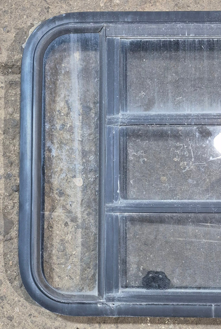 Used Black Radius Opening Window : 29 1/2" W x 22 1/2" H x 1 3/4" - Young Farts RV Parts