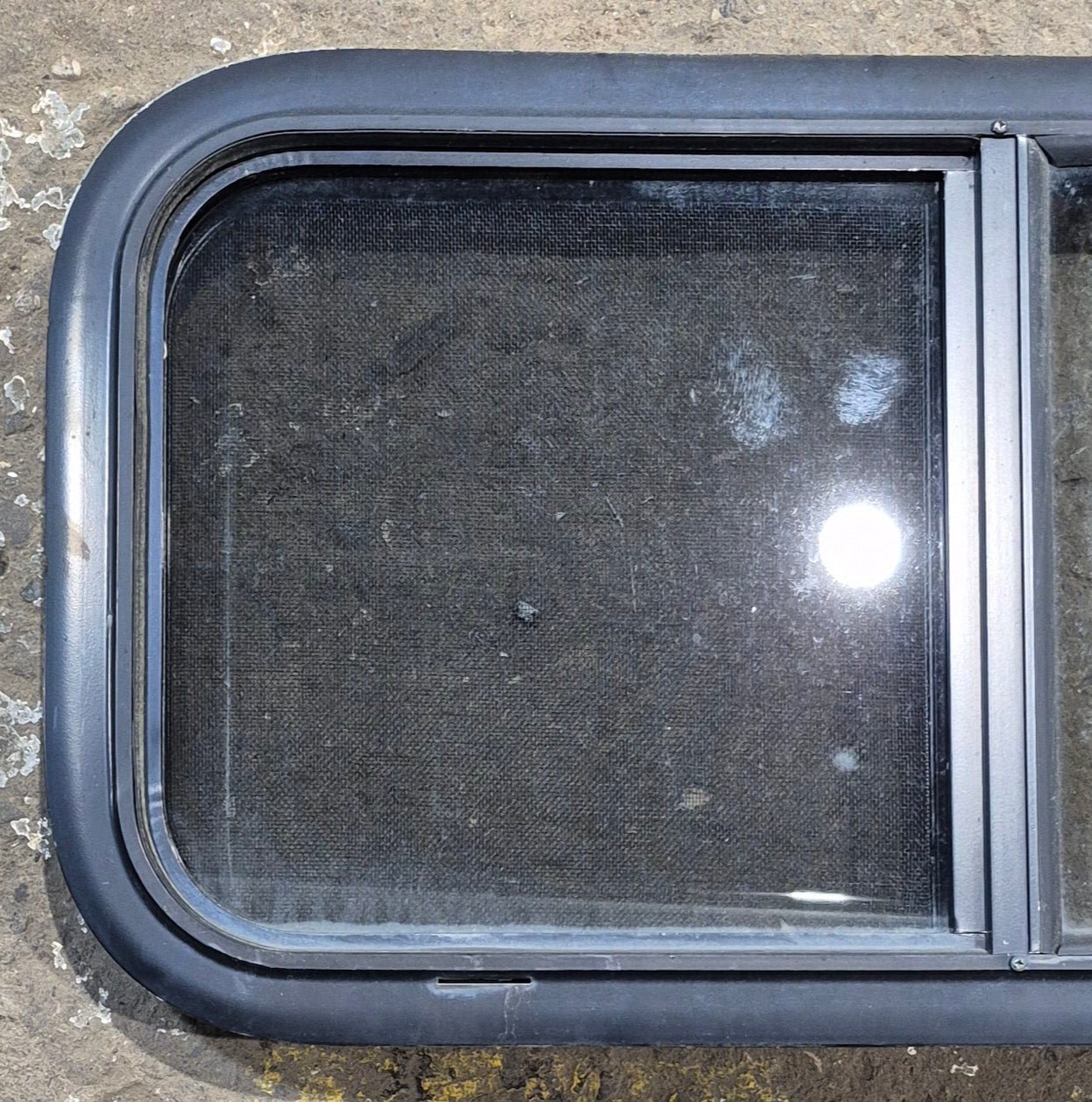 Used Black Radius Opening Window : 29 1/4" W x 14 1/4" H x 1 3/4" - Young Farts RV Parts