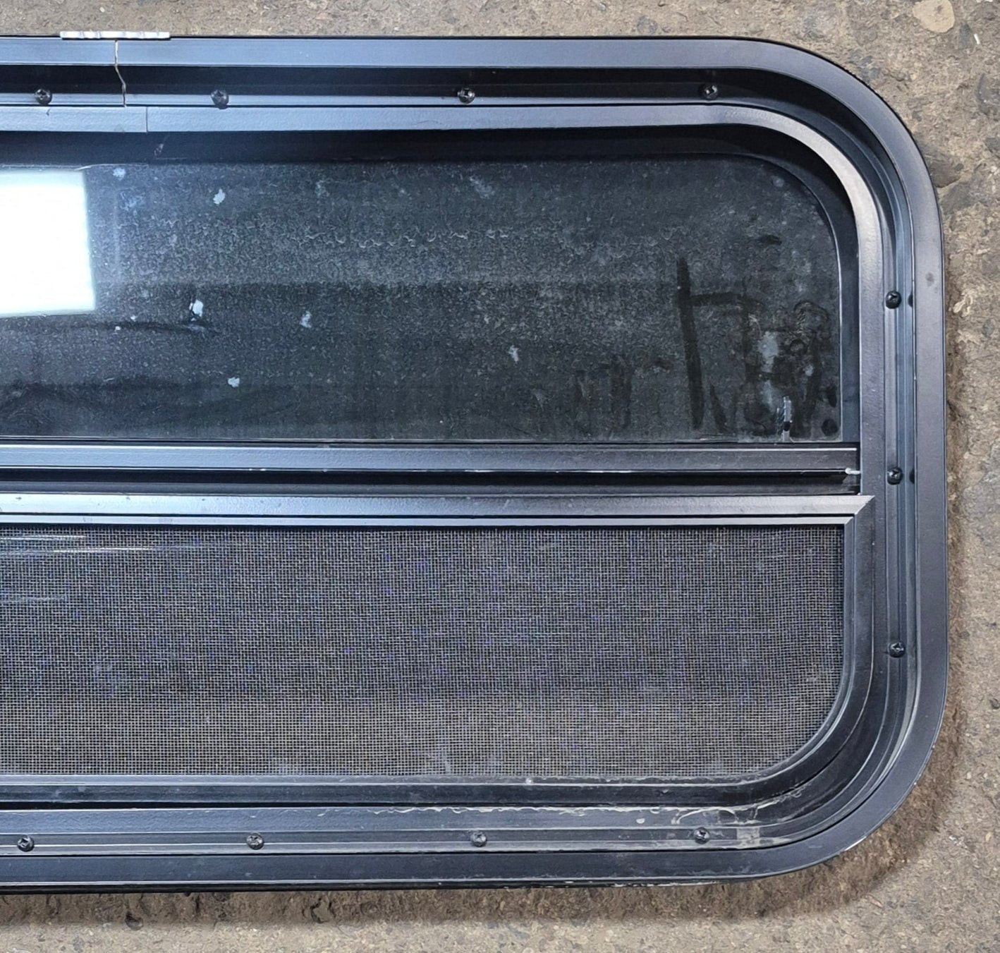 Used Black Radius Opening Window : 29 1/4" W x 14 1/4" H x 1 3/4" - Young Farts RV Parts