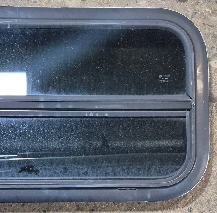 Used Black Radius Opening Window : 29 1/4" W x 14 1/4" H x 1 3/4" - Young Farts RV Parts