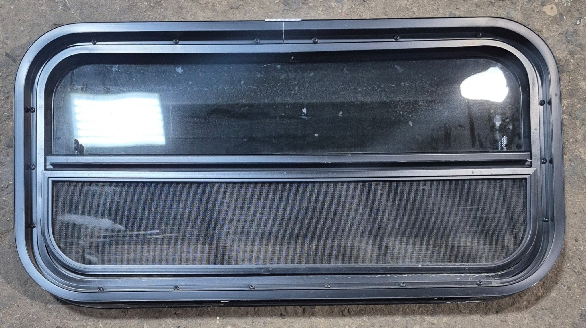 Used Black Radius Opening Window : 29 1/4" W x 14 1/4" H x 1 3/4" - Young Farts RV Parts