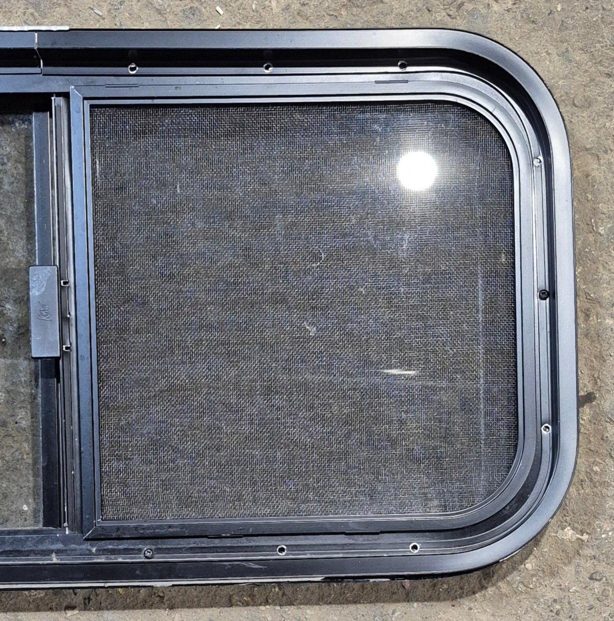 Used Black Radius Opening Window : 29 1/4" W x 14 1/4" H x 1 3/4" - Young Farts RV Parts
