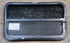 Used Black Radius Opening Window : 29 1/4" W x 17 1/2" H x 1 1/4" - Young Farts RV Parts
