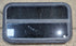 Used Black Radius Opening Window : 29 1/4" W x 17 1/2" H x 1 1/4" - Young Farts RV Parts