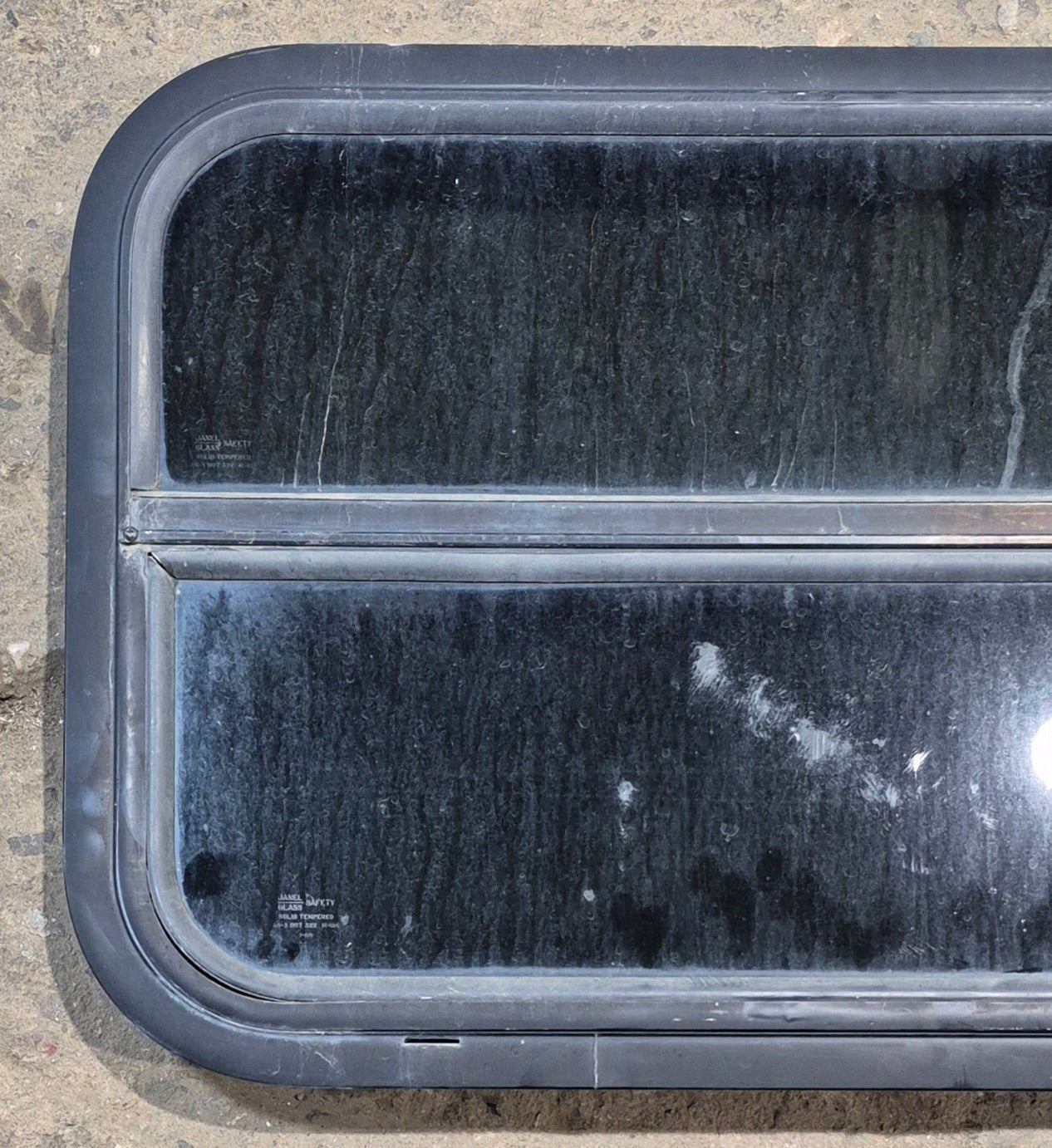 Used Black Radius Opening Window : 29 1/4" W x 17 1/2" H x 1 1/4" - Young Farts RV Parts
