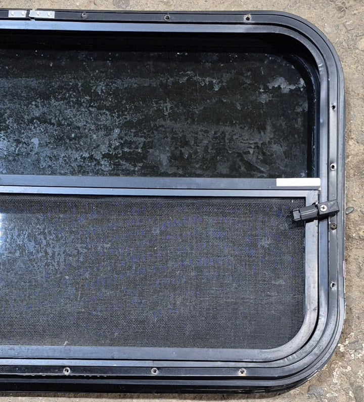 Used Black Radius Opening Window : 29 1/4" W x 17 1/2" H x 1 1/4" - Young Farts RV Parts