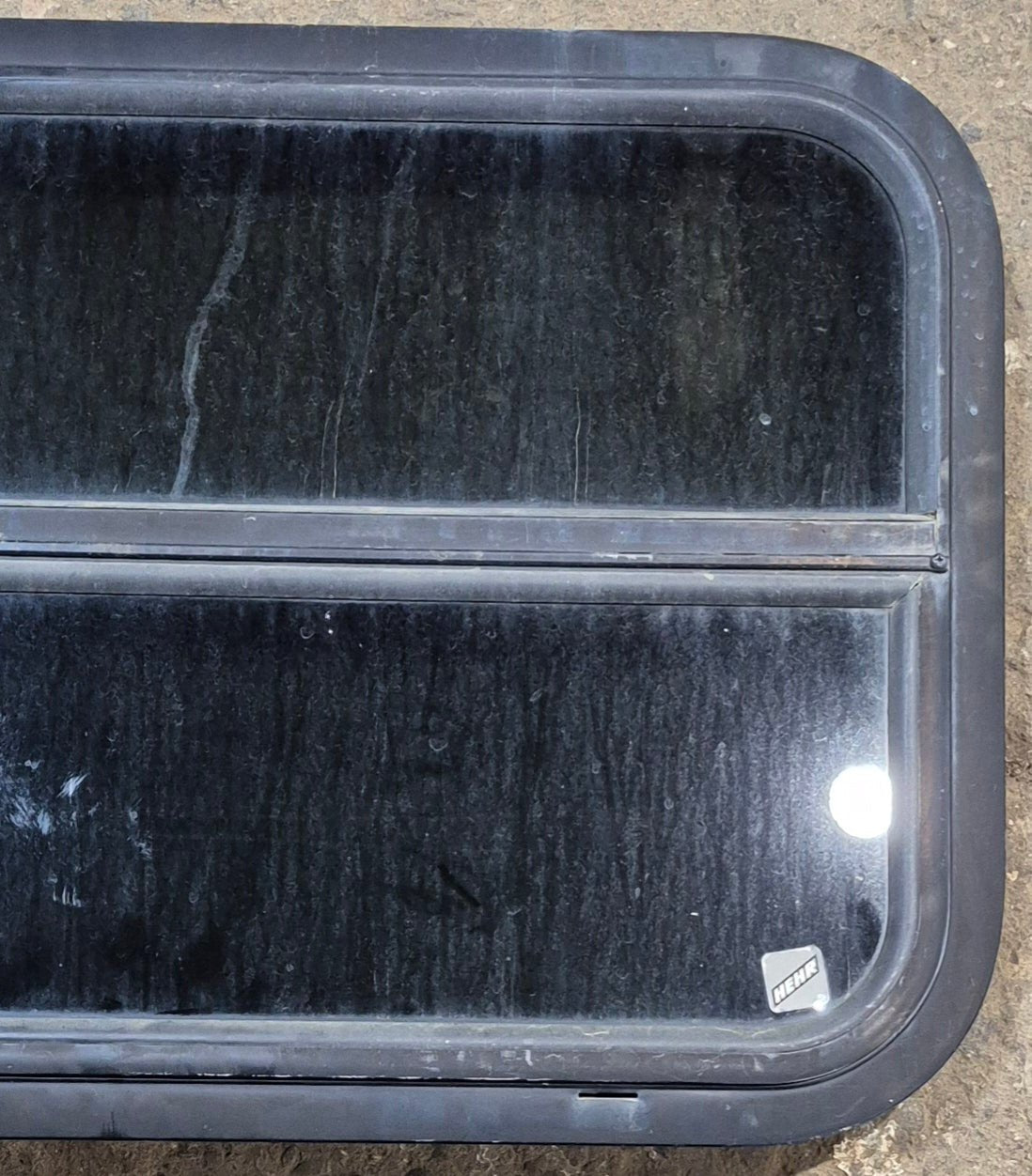 Used Black Radius Opening Window : 29 1/4" W x 17 1/2" H x 1 1/4" - Young Farts RV Parts