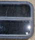 Used Black Radius Opening Window : 29 1/4" W x 17 1/2" H x 1 1/4" - Young Farts RV Parts