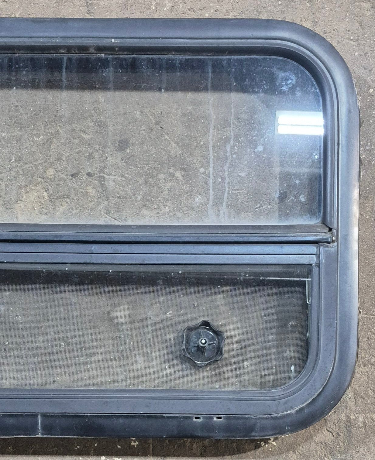 Used Black Radius Opening Window : 29 1/4" W x 17 1/2" H x 1 7/8" D - Young Farts RV Parts