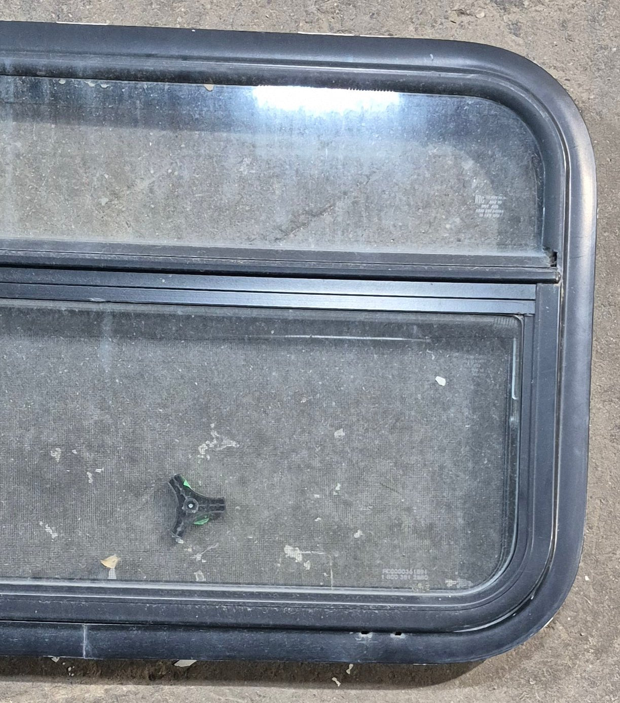Used Black Radius Opening Window : 29 1/4" W x 17 1/4" H x 1 1/4" D - Young Farts RV Parts