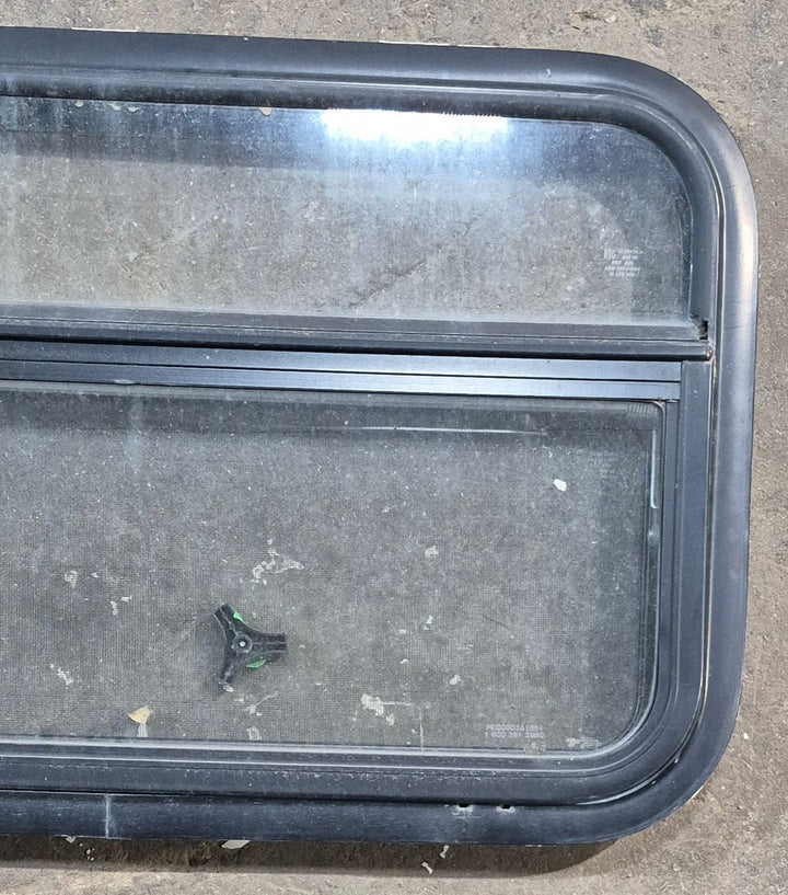 Used Black Radius Opening Window : 29 1/4" W x 17 1/4" H x 1 1/4" D - Young Farts RV Parts
