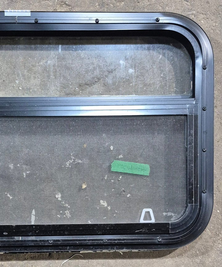 Used Black Radius Opening Window : 29 1/4" W x 17 1/4" H x 1 1/4" D - Young Farts RV Parts