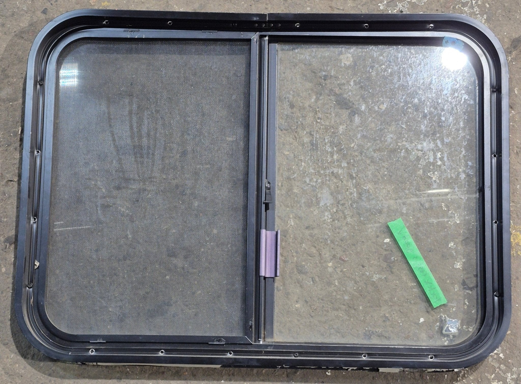 Used Black Radius Opening Window : 29 1/4" W x 21 1/4" H x 1 3/4" D - Young Farts RV Parts
