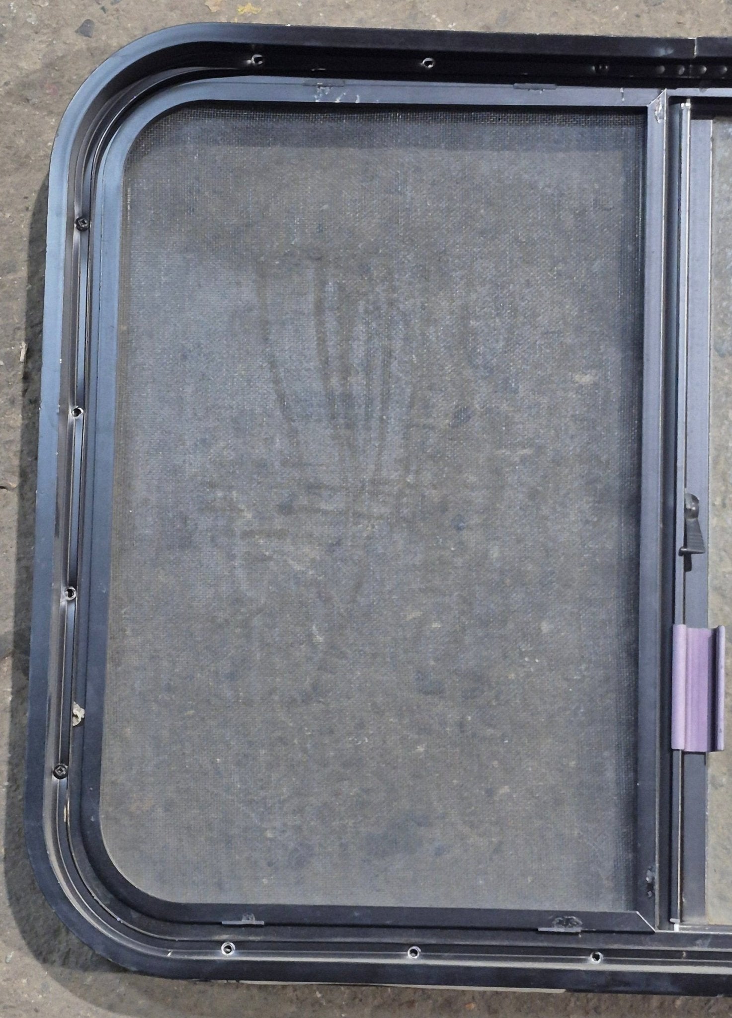 Used Black Radius Opening Window : 29 1/4" W x 21 1/4" H x 1 3/4" D - Young Farts RV Parts