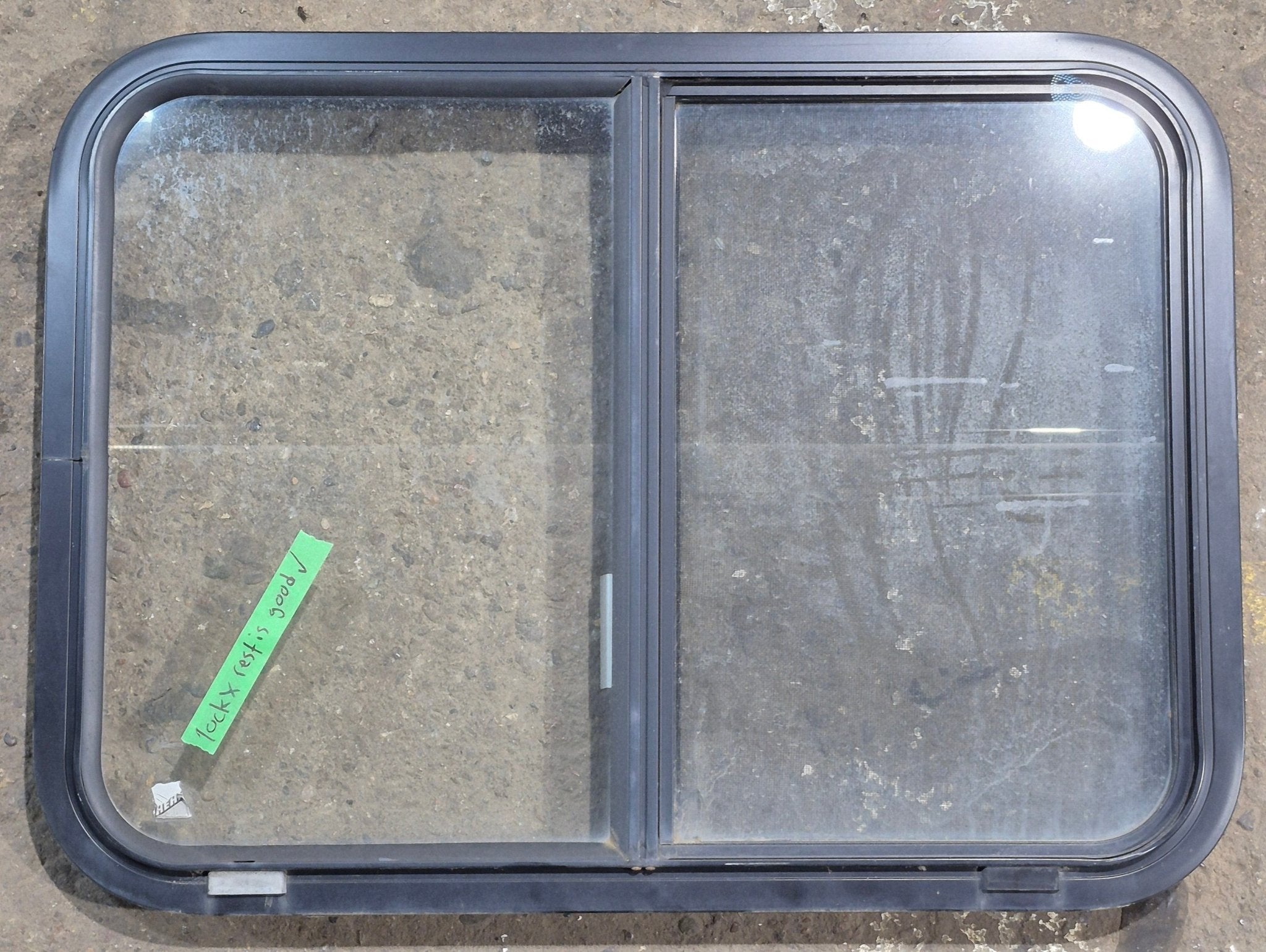 Used Black Radius Opening Window : 29 1/4" W x 21 1/4" H x 1 3/4" D - Young Farts RV Parts