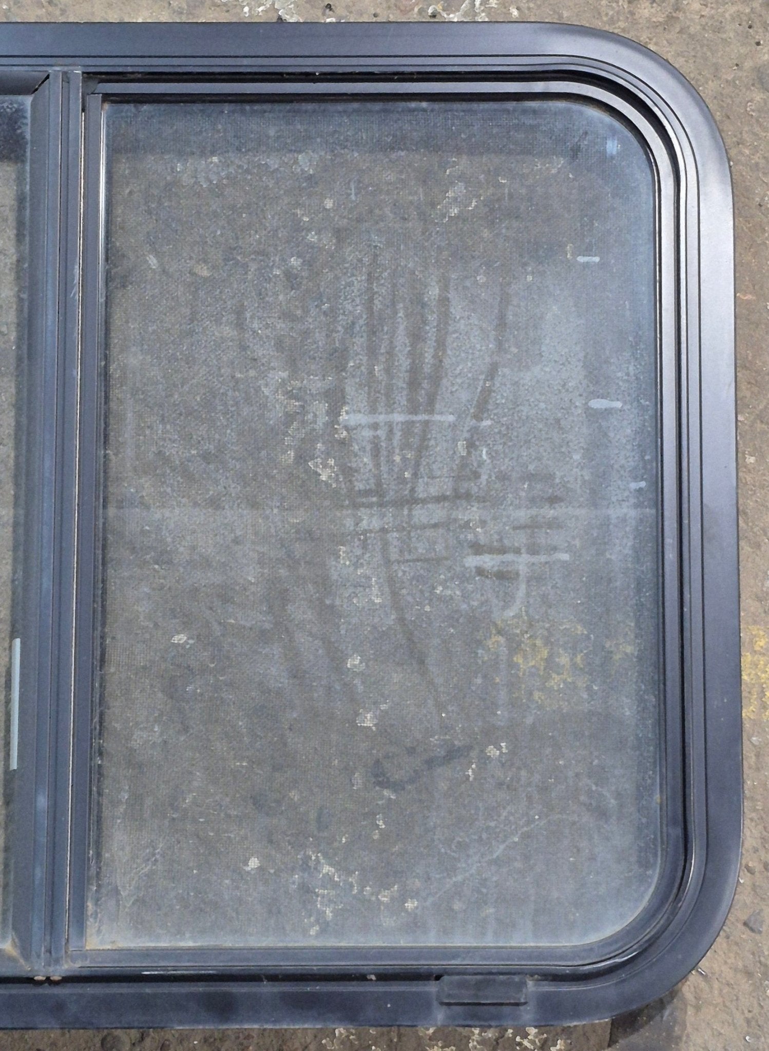 Used Black Radius Opening Window : 29 1/4" W x 21 1/4" H x 1 3/4" D - Young Farts RV Parts