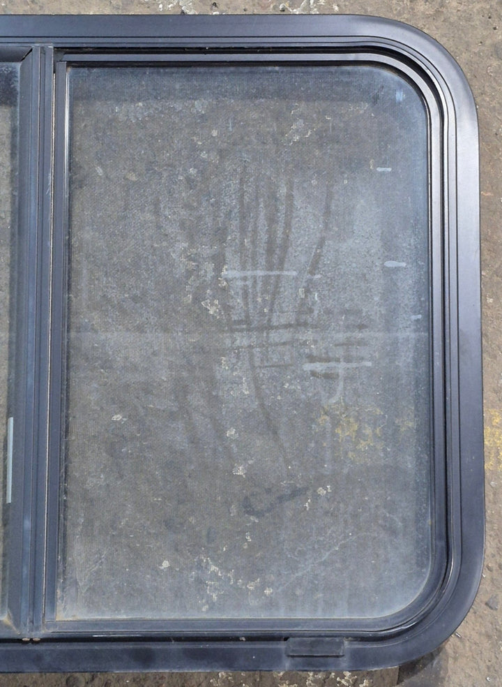 Used Black Radius Opening Window : 29 1/4" W x 21 1/4" H x 1 3/4" D - Young Farts RV Parts