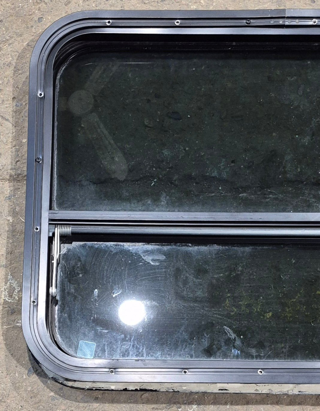 Used Black Radius Opening Window : 29 1/4" W x 21 1/4" H x 2" - Young Farts RV Parts