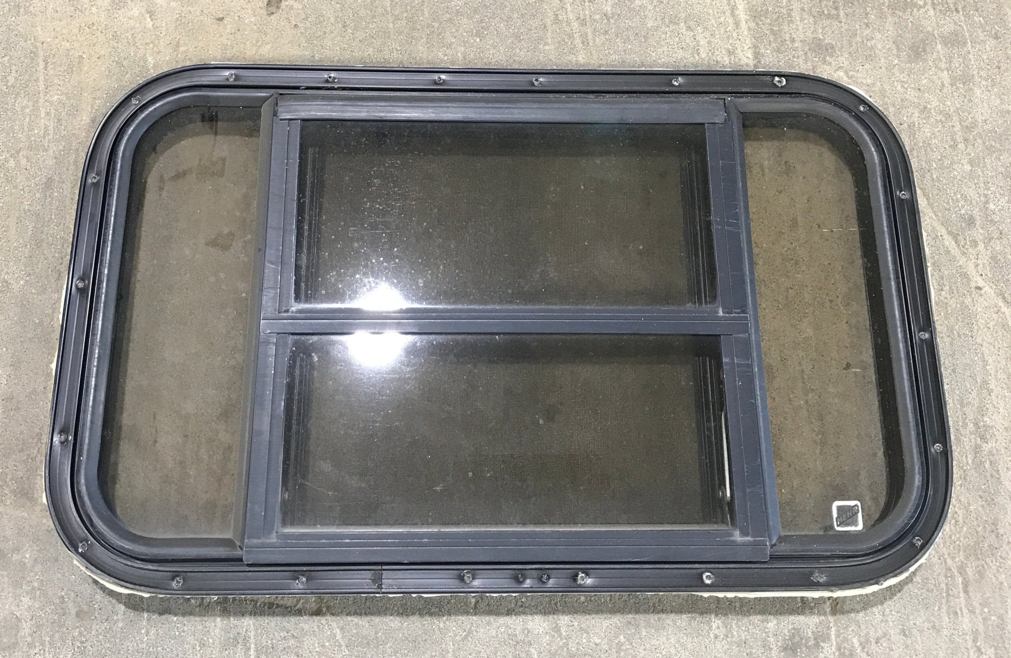 Used Black Radius Opening Window : 30 1/2" W x 18 3/4" H x 1 1/2" D - Young Farts RV Parts