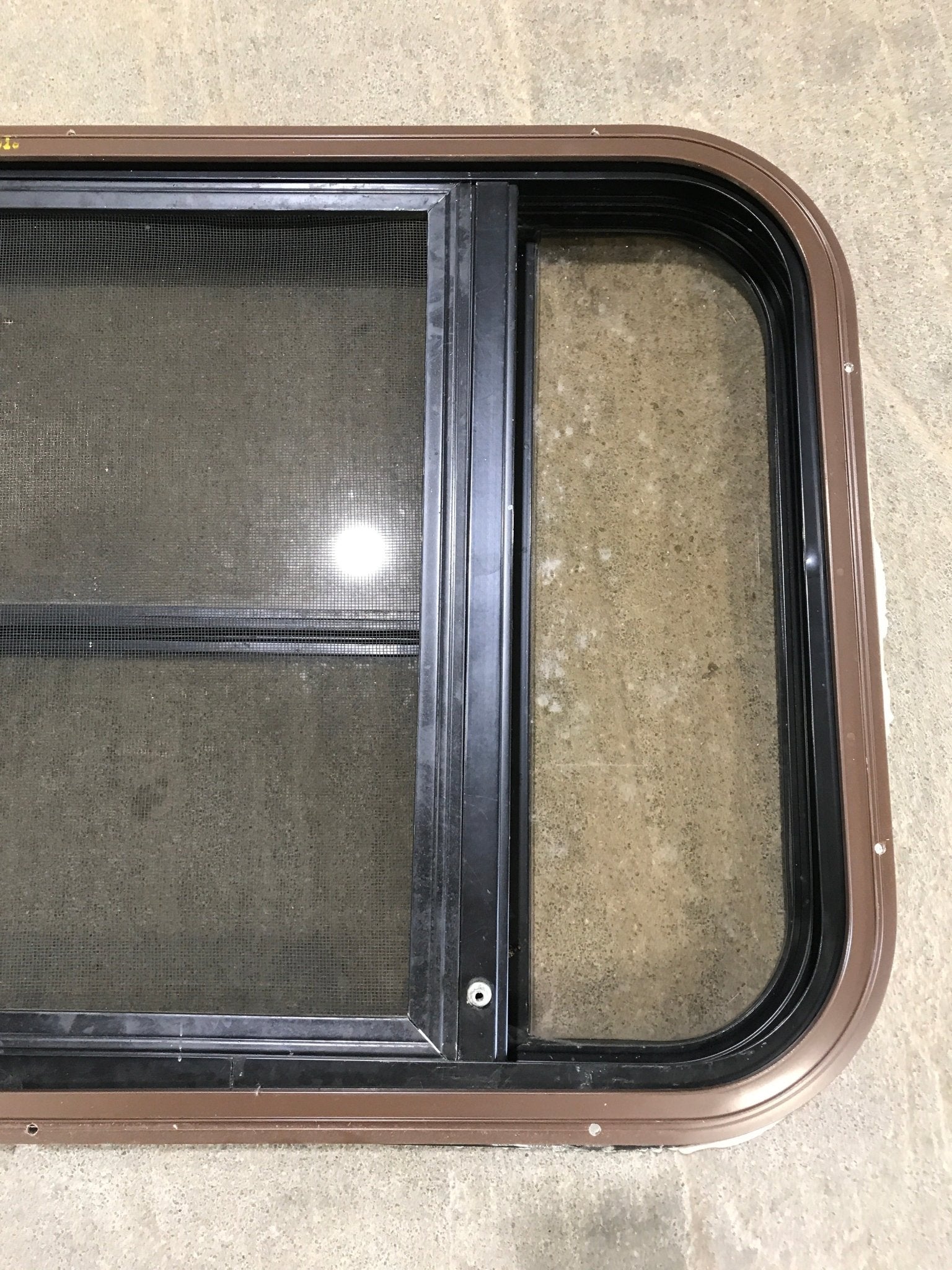Used Black Radius Opening Window : 30 1/2" W x 18 3/4" H x 1 1/2" D - Young Farts RV Parts