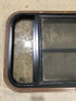 Used Black Radius Opening Window : 30 1/2" W x 18 3/4" H x 1 1/2" D - Young Farts RV Parts