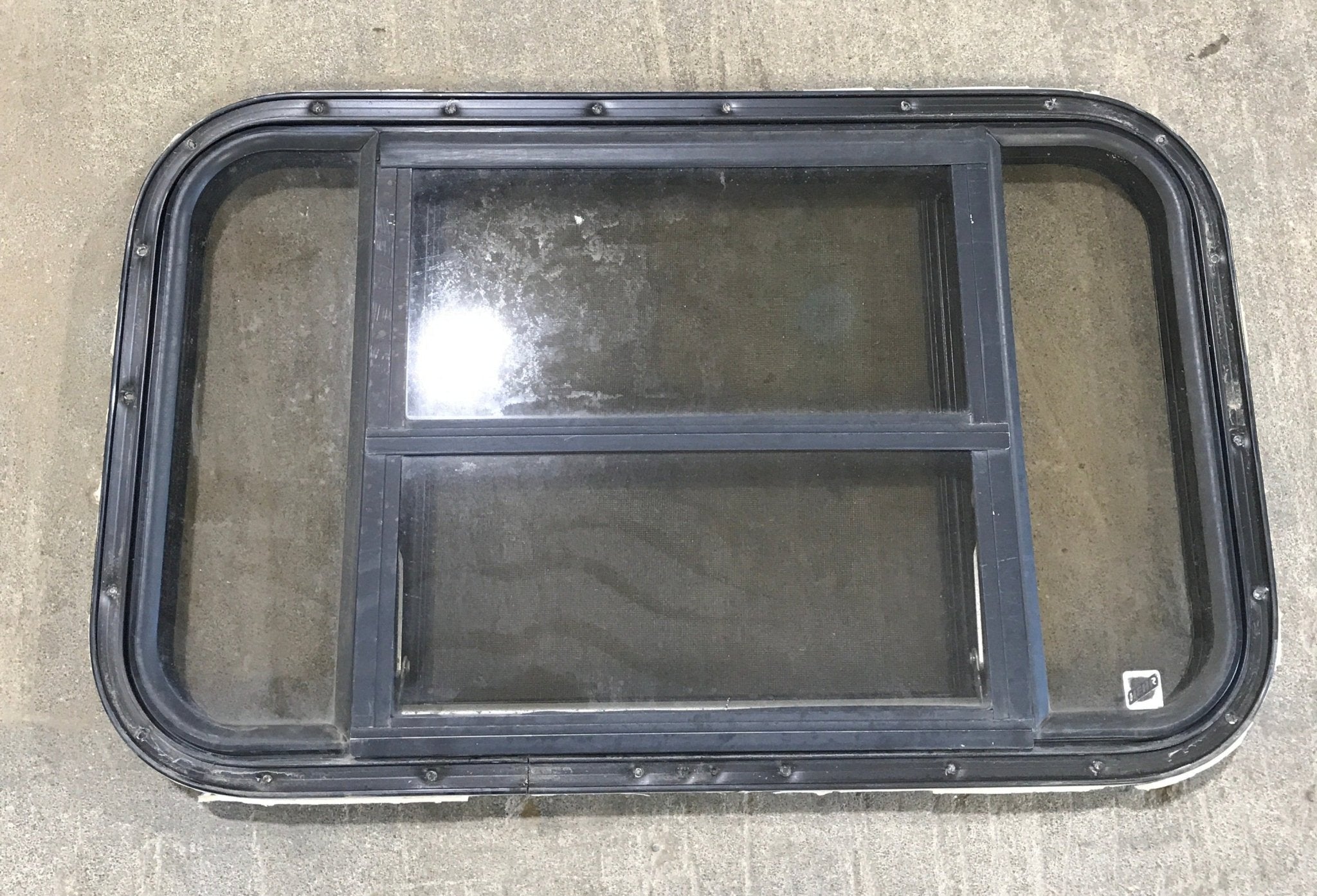 Used Black Radius Opening Window : 30 1/2" W x 18 3/4" H x 1 1/2" D - Young Farts RV Parts