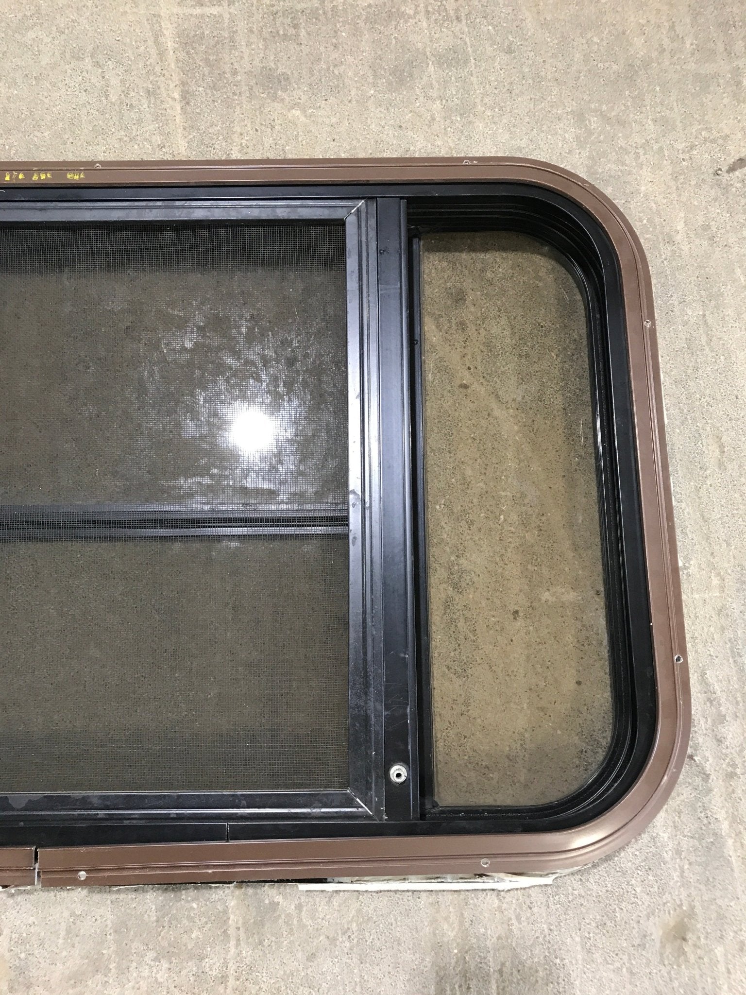 Used Black Radius Opening Window : 30 1/2" W x 18 3/4" H x 1 1/2" D - Young Farts RV Parts