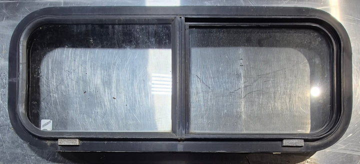 Used Black Radius Opening Window : 30 1/4" W x 11 3/4" H x 1 3/4" - Young Farts RV Parts