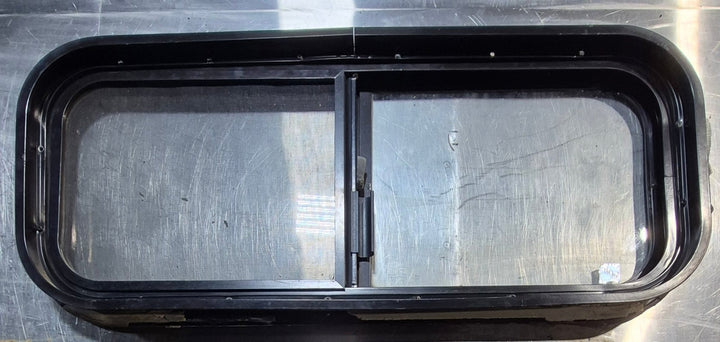 Used Black Radius Opening Window : 30 1/4" W x 11 3/4" H x 1 3/4" - Young Farts RV Parts