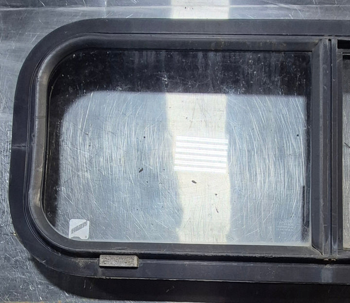 Used Black Radius Opening Window : 30 1/4" W x 11 3/4" H x 1 3/4" - Young Farts RV Parts