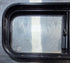 Used Black Radius Opening Window : 30 1/4" W x 11 3/4" H x 1 3/4" - Young Farts RV Parts