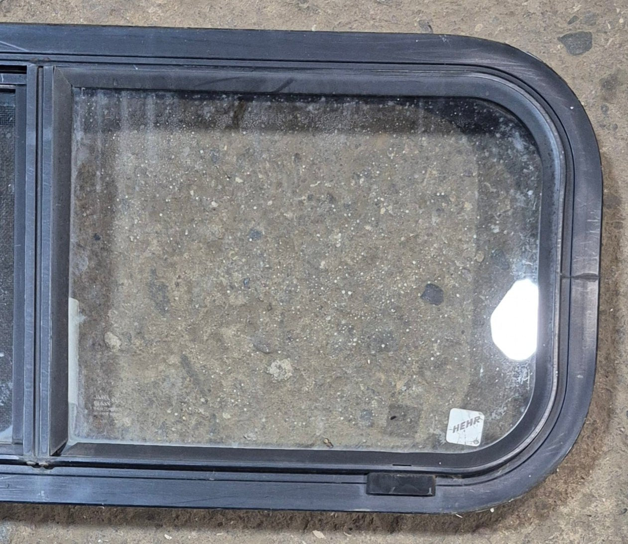 Used Black Radius Opening Window : 30 1/4" W x 11 3/4" H x 1 7/8" - Young Farts RV Parts