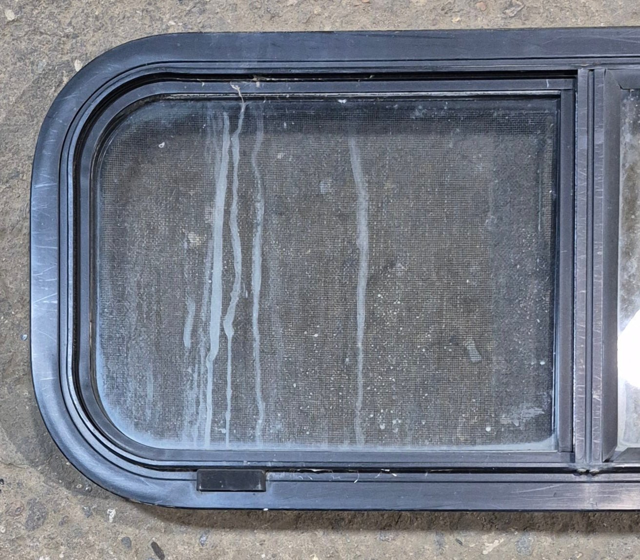 Used Black Radius Opening Window : 30 1/4" W x 11 3/4" H x 1 7/8" - Young Farts RV Parts