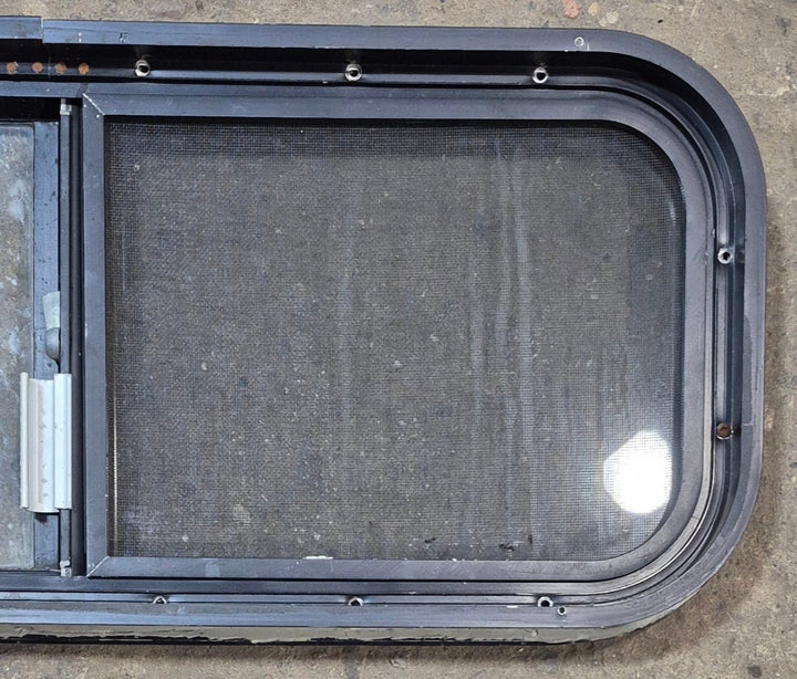 Used Black Radius Opening Window : 30 1/4" W x 11 3/4" H x 1 7/8" - Young Farts RV Parts