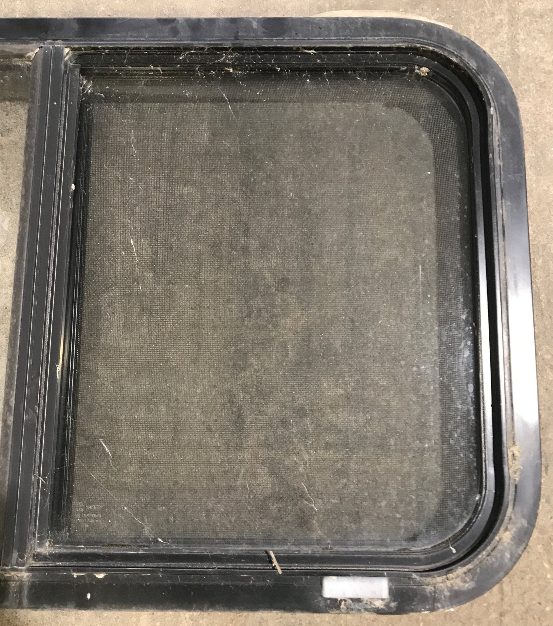 Used Black Radius Opening Window : 30 1/4" W x 17 3/4" H x 1 7/8" D - Young Farts RV Parts