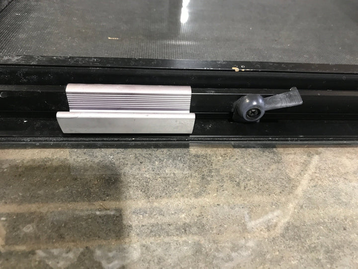 Used Black Radius Opening Window : 30 1/4" W x 17 3/4" H x 1 7/8" D - Young Farts RV Parts