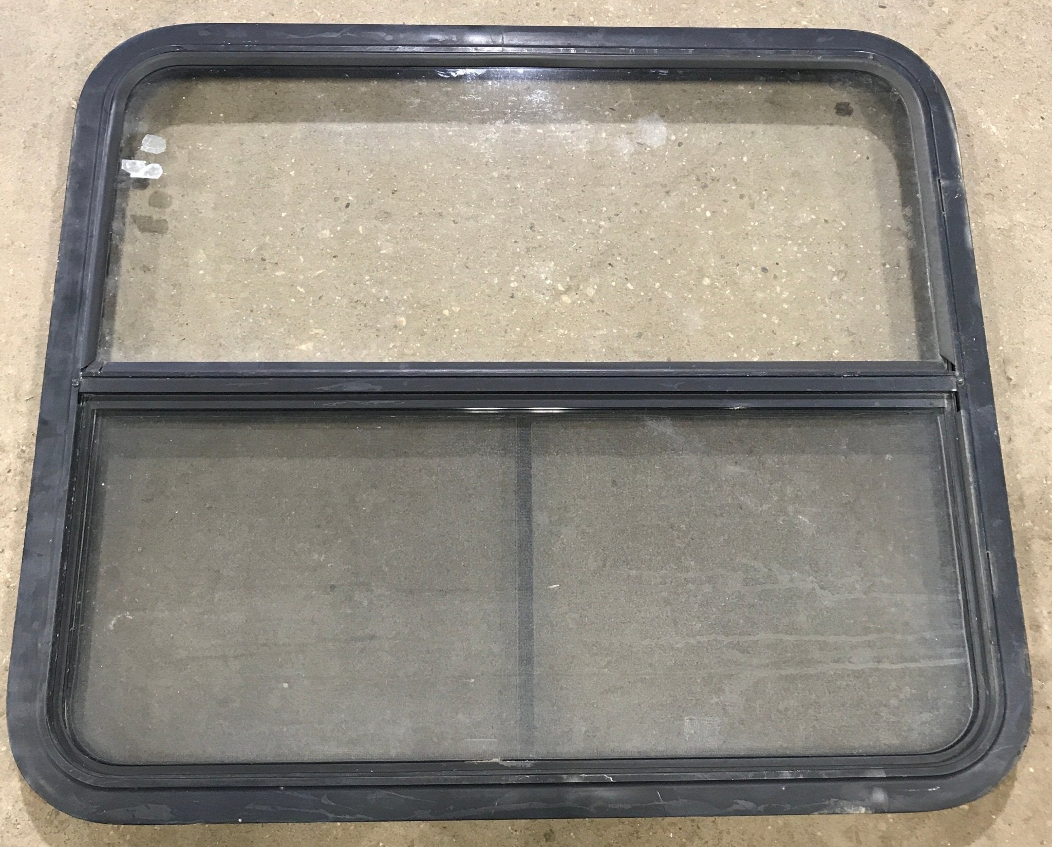 Used Black Radius Opening Window : 34 1/2" W x 29 1/2" H x 1 7/8" D - Young Farts RV Parts